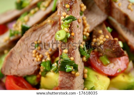 Lamb fillet with tomato, cucumber and avocado salsa with herb vinegarette.