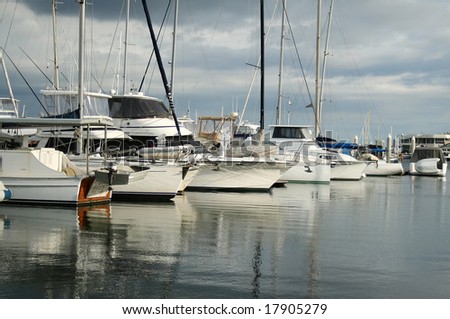 Bows of boats lined up at Southport Marina on the Gold Coast Australia in the early morning light.