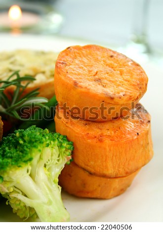 Baked sweet potato stack with broccoli and rosemary.