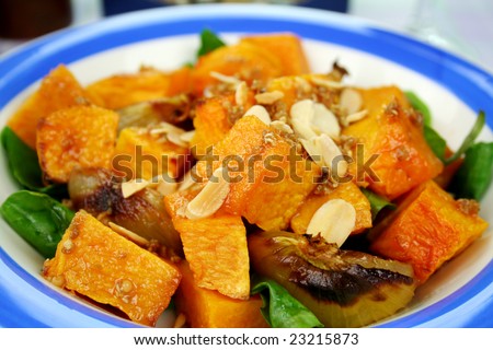 Roasted pumpkin and onion salad with wilted spinach and toasted almonds.