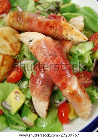 Chicken tenderloins wrapped in prosciutto with oven roasted chat potatoes and a garden salad.