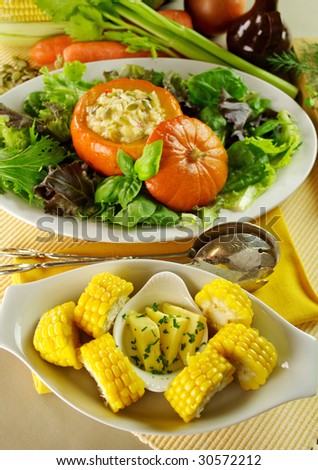 Corn cobs and baked golden nugget pumpkin with rice stuffing.