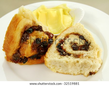 Delicious sliced chelsea bun with dried fruit ready to serve.