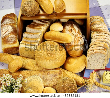 Selection of different types of rolls, loaves and bread sticks.