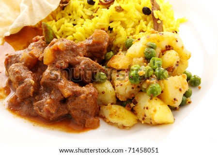Delicious and spicy Indian beef curry served with pappadums.