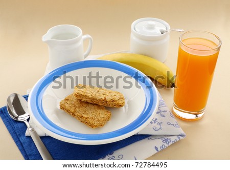 Iconic Australian breakfast cereal Weet Bix served with juice and milk.