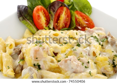 Delicious creamy chicken penne pasta with a garden salad.