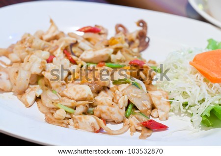 stir fried squid with salted egg yolk, thai fusion food style