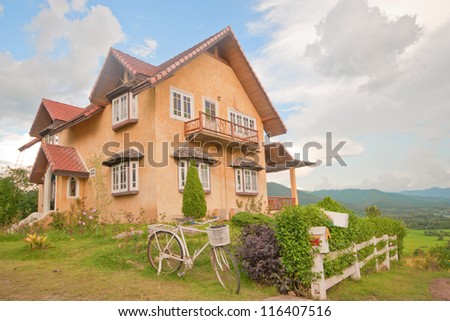 house on hill with blue sky