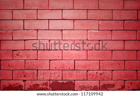 red brick wall getting older from the bottom