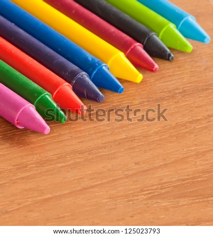wax crayons on wood table
