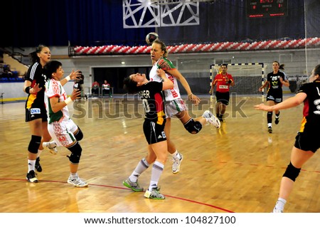 MINSK, BELARUS - MAY 30: Unidentified handball players (Belarus, white) in attack during European Championship qualifying match (Belarus  Germany) on May 30, 2012 in Minsk, Belarus.