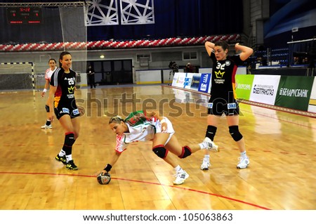 MINSK, BELARUS - MAY 30: Unidentified handball players (Germany(black) violate the rules during European Championship qualifying match (Belarus Germany) on May 30, 2012 in Minsk, Belarus.