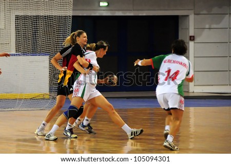 MINSK, BELARUS - MAY 30: Unidentified handball players (Belarus, white) in attack during European Championship qualifying match (Belarus Germany) on May 30, 2012 in Minsk, Belarus.