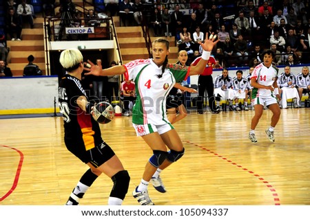 MINSK, BELARUS - MAY 30: Unidentified handball players (Germany(black) in attack during European Championship qualifying match (Belarus Germany) on May 30, 2012 in Minsk, Belarus.