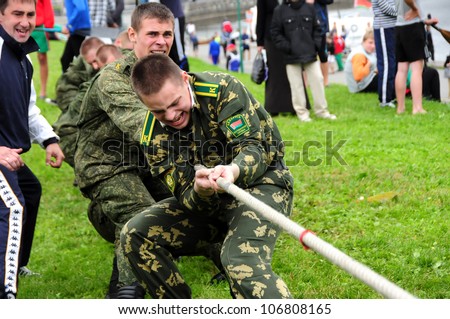 MINSK, BELARUS - Â?Â?JUNE 23: Unidentified team of soldiers compete in tug of war during NATIONAL OLYMPIC DAY on June 23, 2012 in Minsk, Belarus.