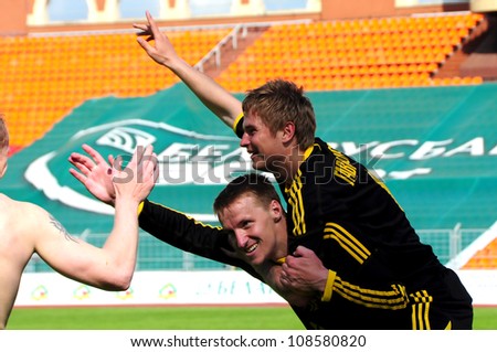 MINSK, BELARUS MAY 20: Unidentified players (FC NAFTAN) celebrate their victory in final cup match between FC NAFTAN and FC MINSK on May 20, 2012 in Minsk, Belarus