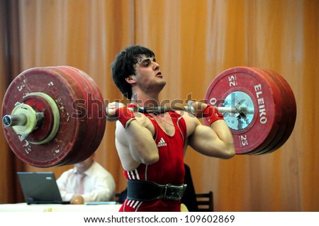 MINSK BELARUS MAY 31 Unidentified sportsman is trying to take the weight during Belarus Open Championship in weightlifting on May 31 2012 in Minsk Belarus MINSK BELARUS MAY 31 Unidentified sportsman is trying to take the weight during Belarus Open Championship in weightlifting on May 31 2012 in Minsk Belarus
