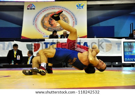 MINSK, BELARUS - SEPTEMBER 16: Unidentified wrestlers fighting in the pit during Grand Prix for the prizes A.Medved in freestyle wrestling on September 16, 2012 in Minsk, Belarus.