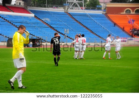 MINSK, BELARUS - May 12:The moment after goal (Ruslan Kopantsov(left) and unidentified players (Minsk) during the match between FC Belshina and FC MINSK (white) on May 12, 2012 in Minsk, Belarus