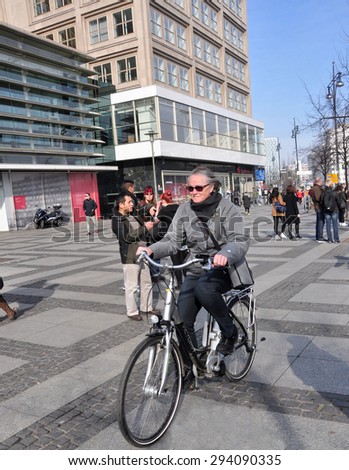 BERLIN MARCH 6: Unidentified female on the bicycle (over 15% people in Berlin prefer moving by bike) on March 6, 2015.