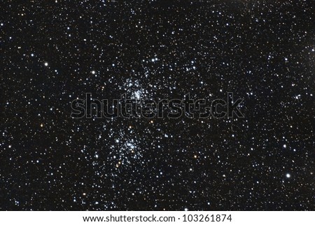 a very deep and real image taken with telescope of the famous stars double cluster in the constellation of perseus
