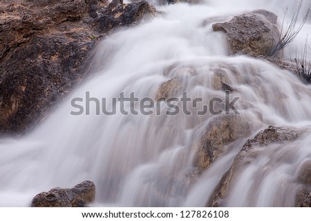 A view of a waterfall between two gaps