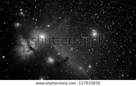 real picture taken by telescope of famous region in orion constellation that includes horsehead and flaming tree nebulaes