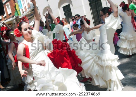CORDOBA, SPAIN - MAY 3: Women performing a sevillana dance in the street, in San Nicolas square, celebrating CordobaÂ´s Cruxes, on may 3, 2014, in Cordoba, Spain