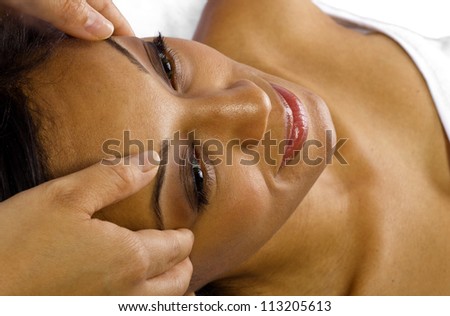 Young African American female getting a facial/head massage