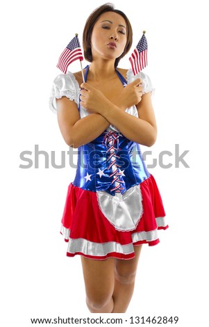 Asian American.  Young Asian female dressed in American flag costume and isolated on a white background