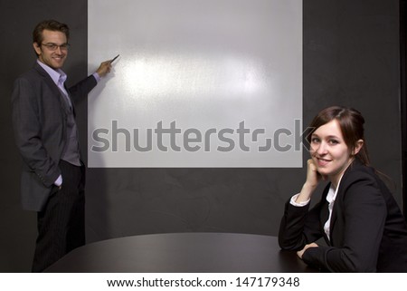 Conference room with blank screen for logo space