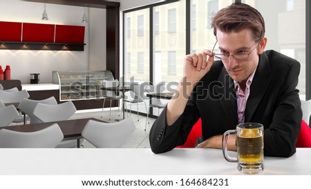 young businessman having beer at his lunch break