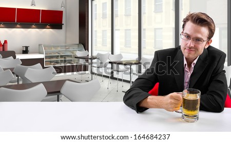 young businessman having beer at his lunch break