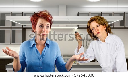 young waitress and chef fighting in a kitchen