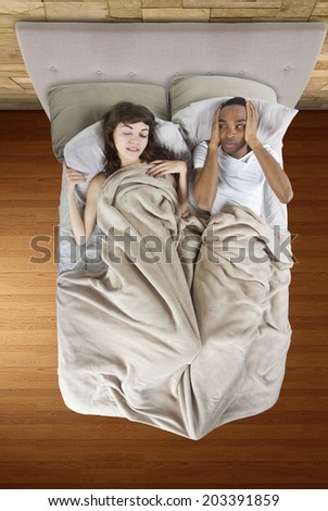 unable to sleep in bed because of snoring partner