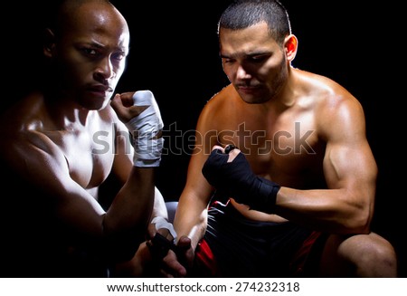 Trainer motivating a muscular Boxer or MMA fighter with pep talks