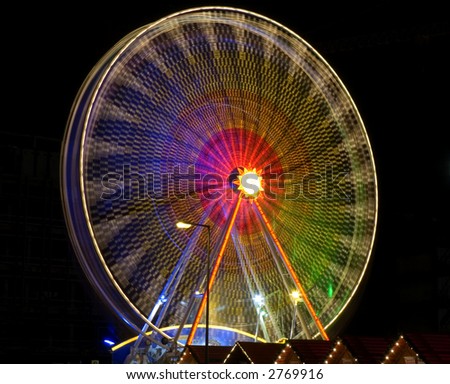 A big wheel blur at a fun fair Berlin
