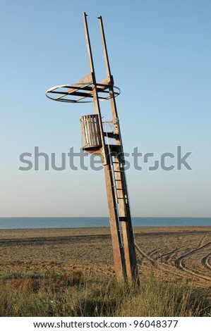 There is a wood watchtower in the beach. The place where is the baywatch to watch the beach and help de people.