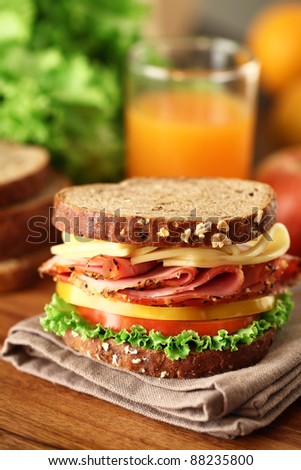A fresh deli sandwich with tomatoes
