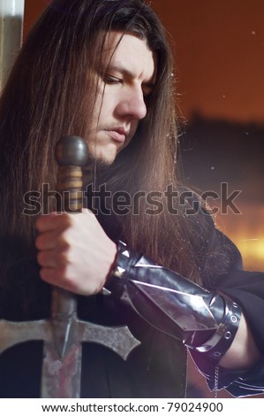 portrait of  man with sword at night art photo
