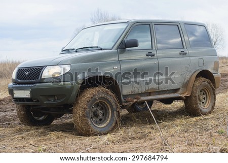ST. PETERSBURG, RUSSIA - APRIL 05, 2015: UAZ-Patriot on the muddy field close up
