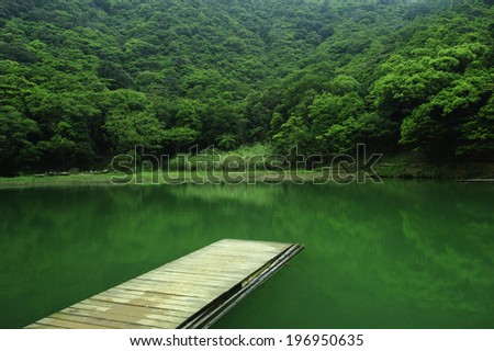 A dock leading out onto a body of water.