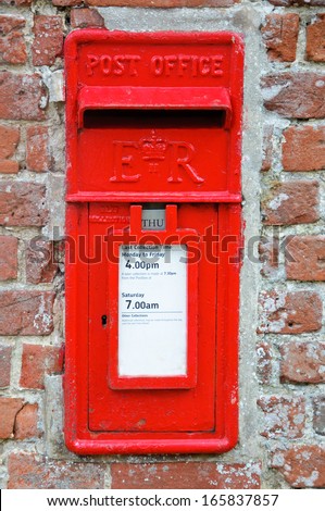 British Red Post Box set in brick wall