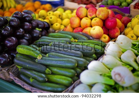 Open market shelves full of a different kinds of vegetables