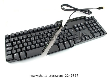 Modern keyboard cut completely in half showing keys and wires still in place