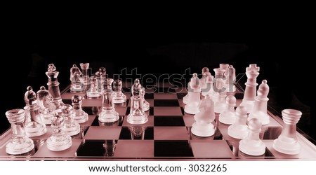 Glass Chess Pieces on a Frosted Glass Chess Board