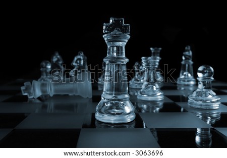 Glass Chess Pieces on a Frosted Glass Chess Board
