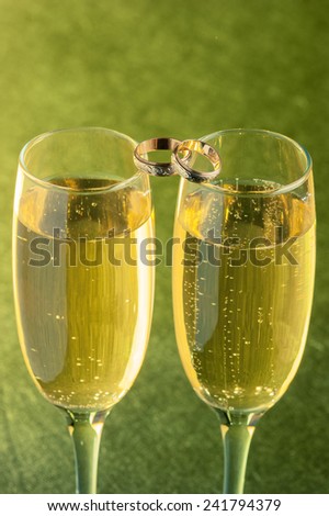two glasses of champagne were photographed in a photographic studio