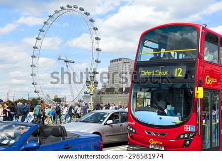 LONDON, ENGLAND - MAY 30:  London Eye and double-decker bus in the city center on May 30, 2015 in London